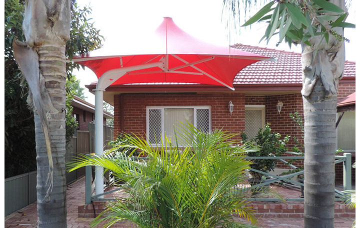 Photograph of Alfresco Model. Fixed, non collapsible umbrella.  Fabric PVC red.