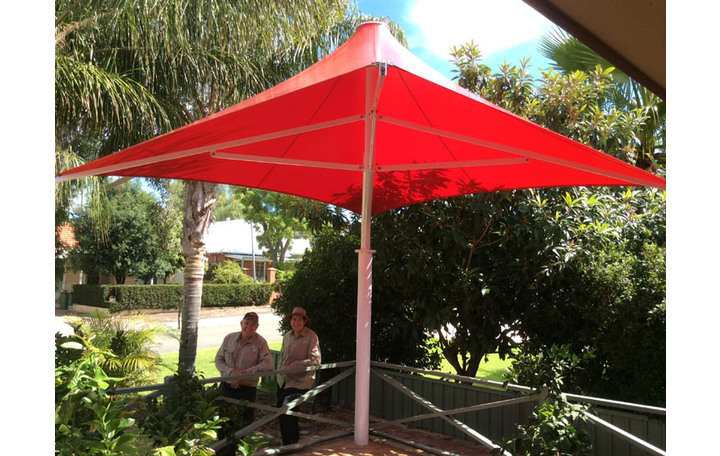Photograph of Alfresco Model. Fixed non collapsible style.  PVC fabric. Red.