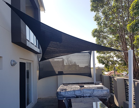 Photograph of Sail and Privacy Screen over spa. Fabric is Rainbow Extreme 32 in charcoal.