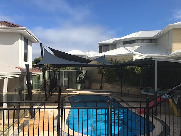 Photograph of These sails were engineered and approved by council which we took care of for the customer.
Main aim was privacy from overlooking neighbours but we also made great shade over the pool.
8 x posts 
Rainbowshade Z16 Charcoal
