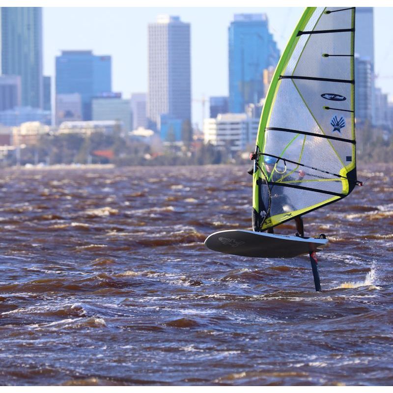 Photograph of Denis J foiling in a Swan River Norwester