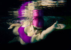 overarm laps in chlorine resistant swimwear at the pool
